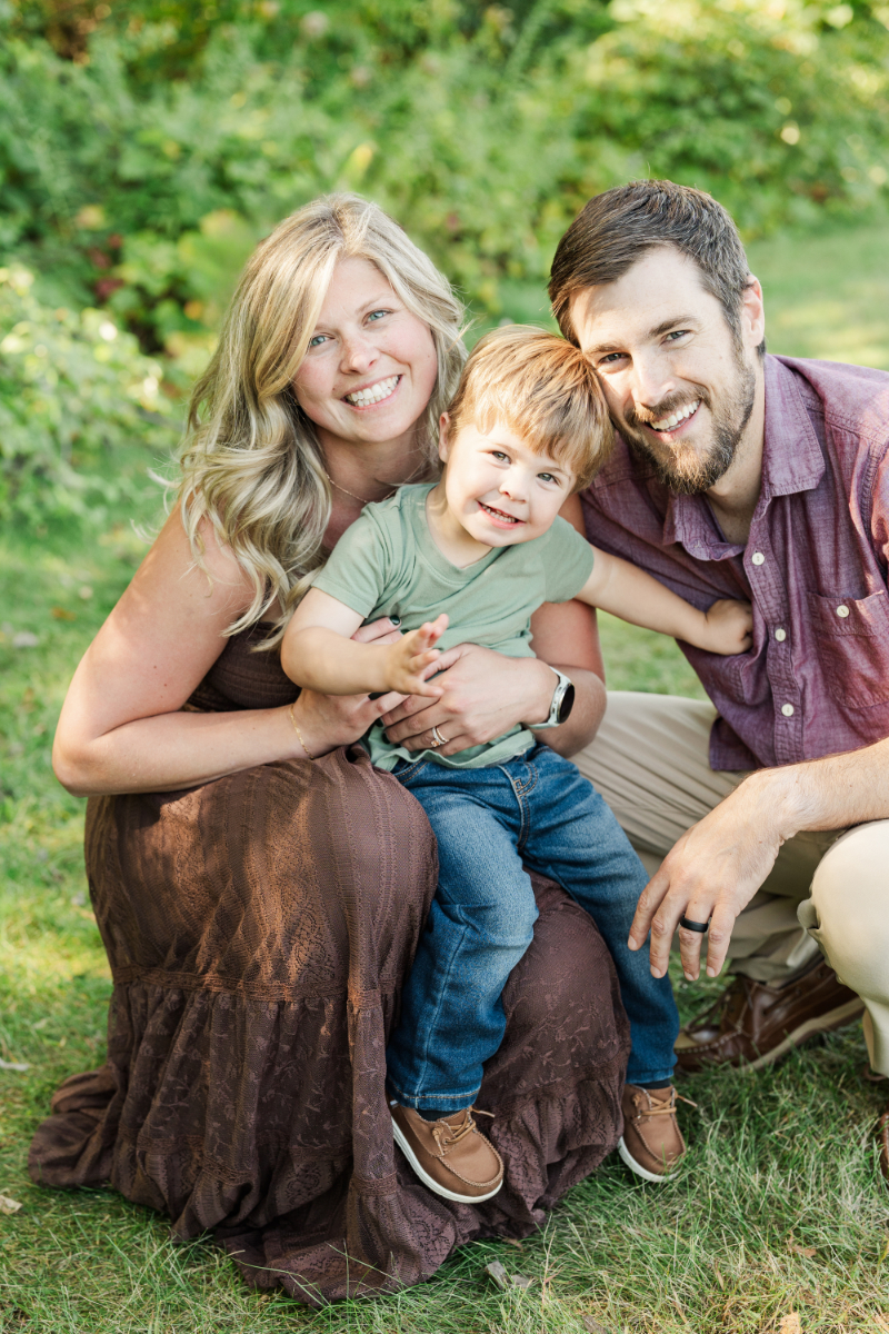 Mother’s Day gift ideas with joyful family of three smiling during outdoor Minneapolis photo session